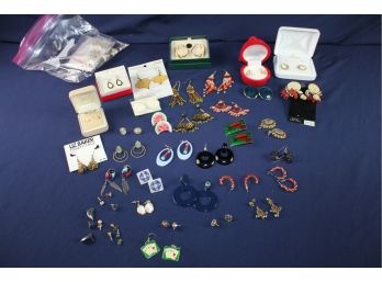 Pierced Earrings And A Bag Of Parts
