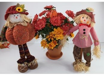 Two Scarecrows And Silk Flower Arrangement