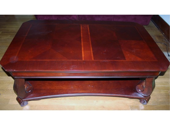 Cherry Colored Heavy Wood Coffee Table 50 X 30 X 19.5 Tall With Lower Shelf, Small Chip On One Leg