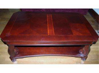 Cherry Colored Heavy Wood Coffee Table 50 X 30 X 19.5 Tall With Lower Shelf, Small Chip On One Leg