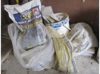 Assorted Bags Of Concrete And Paver Base