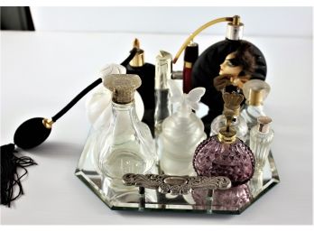 Multiple Vintage Perfume Bottles On Mirrored Dresser Tray