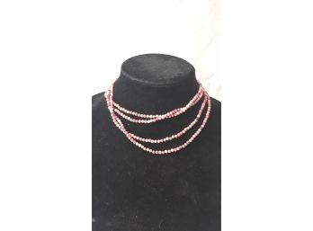 Long Strand Of Coral Beaded Necklace