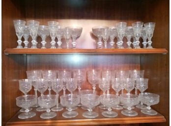 Two Shelves Of Cut Crystal Stemware