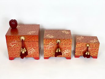 Three Decorated Nesting Boxes With Red Tassels