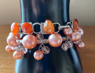 Pair Of Coral Colored Bracelets