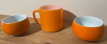 A Pair Of F Heat Proof USA Orange Coffee Mugs And An Orange Sugar Dish