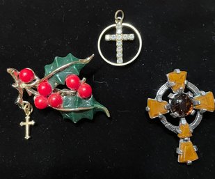 Two Pins And A Pendant With Crosses