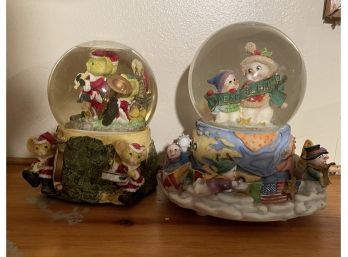 Two Vintage Christmas Themed Snow Globes