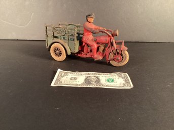 Antique Iron Indian Motorcycle With Driver  And A Traffic Car Wagon.