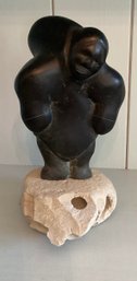 Sculpture Of A Mounted Obsidian Inuit EskimoCarrying A Heavy Load