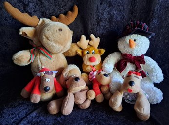 A Snowman And All His Reindeer Pals