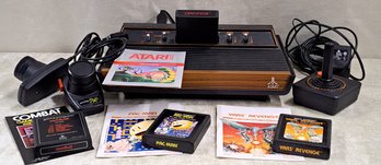 Vintage Atari Game Center With Controllers And Games