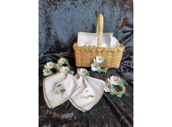 Basket Of Embroidered Napkins And Flower Napkin Rings