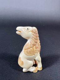 A Japanese Netsuke Carved Horse