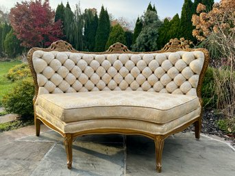 A Curved Tufted Settee
