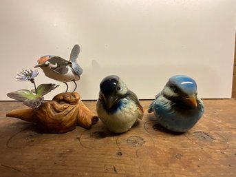 A Collection Of Small Ceramic Birds
