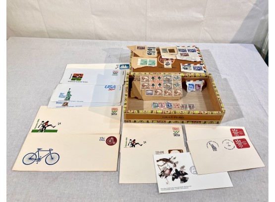 Lot Of Foreign Stamps And Pre-postaged Stamped Envelopes In Cigar Box