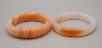 Pair Of White And Orange Bracelets