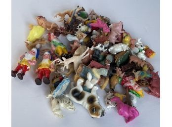 Collection Of Tiny Plastic Animals And Figures