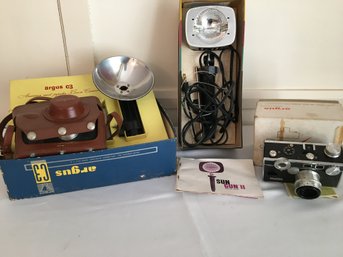 Group Of  Vintage Cameras And Flash Attachments