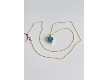 14k Yellow Gold, Oval Blue Topaz Pendant And 14K Yellow Gold Chain #112