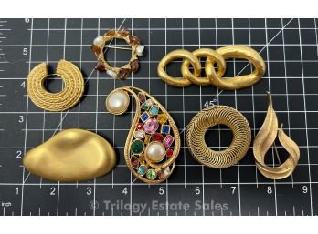 7 Gold-tone Brooches