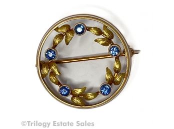 14kt Gold Circle Brooch With Leaves And Five Sapphires