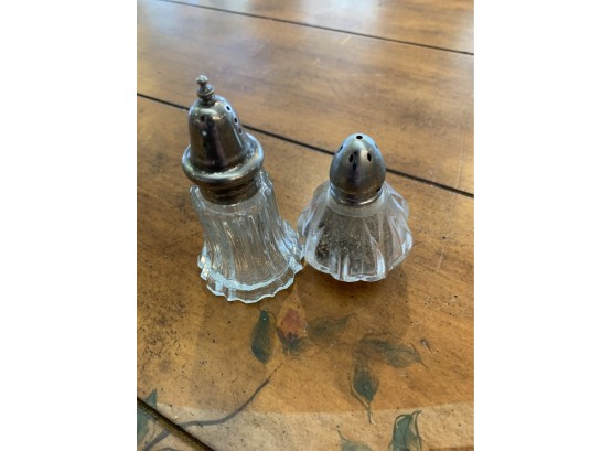 Pair Of Salt And Peppers With Silver Tops