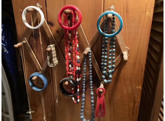 Lot Of Bracelets, NecklaCes And Jewelry Hanging On The Wall