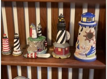 Lot Of Lighthouse Decor Items Including Cheese Knives Salt And Pepper Shakers And A Candle Holder