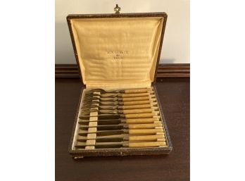 Set Of Antique Aux Cadeaux Forks And Knives With Bone Or Antler Handles And A Alligator Case