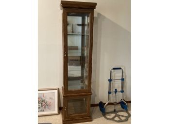 Narrow Curio Cabinet With Mirrored Back And Glass Shelves