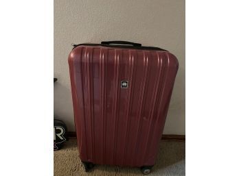 XL. Hard Sided Rolking Suitcase