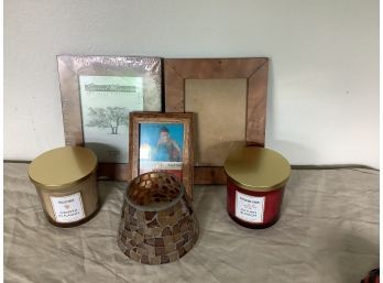 Assortment Of Picture Frames And Candles