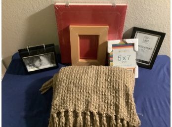 Picture Frames And A Throw Planket With No Rips,  Stains Or Tears
