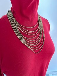 Couture Gold Tone Small Beaded Twelve Strand Necklace