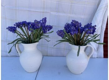 Two Artificial Flowers In Pitchers