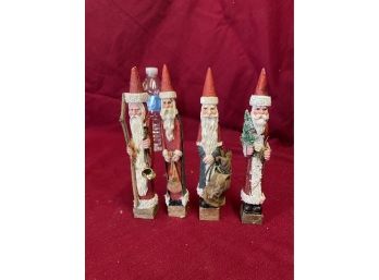 Four Wooden Santa Figures