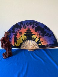 Large Fan And Wooden Fisherman Statue