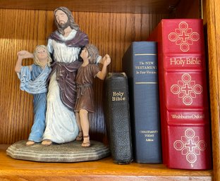 Jesus Statue And Bibles