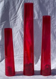 Three Tall Red Glass Vases