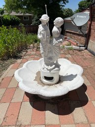 Stone 4 Piece Water Fountain With Children Standing On Top