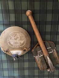 Cot, Military Shovel And Canteen
