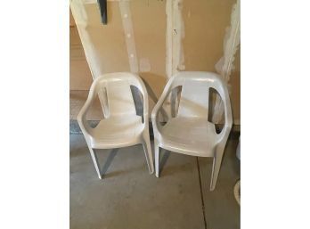 (2) White Plastic Chairs