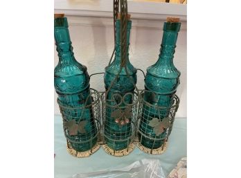 Assorted Table Linens And Gorgeous Sea Green Glass Corked Bottle Set In Wire Carrier