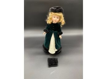 Ceramic Blonde Doll In Green Coat With Faux Fur Muff And Stand