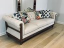 Noble House Beige Fabric Button-Tufted, Three-Seat Couch With Nailhead Trim & Accent Pillows