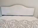 King Bed With Upholstered Cream Colored Headboard With Nailhead Detail And Posturepedic Mattress