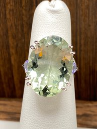 12.00ct Oval Prasiolite With .35ctw Pear Shape Tanzanite Sterling Silver Ring - Size 4